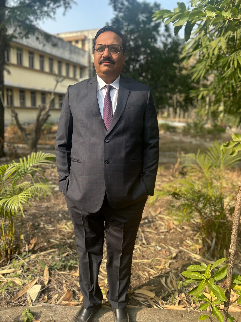 Group of children in colorful graduation gowns celebrating